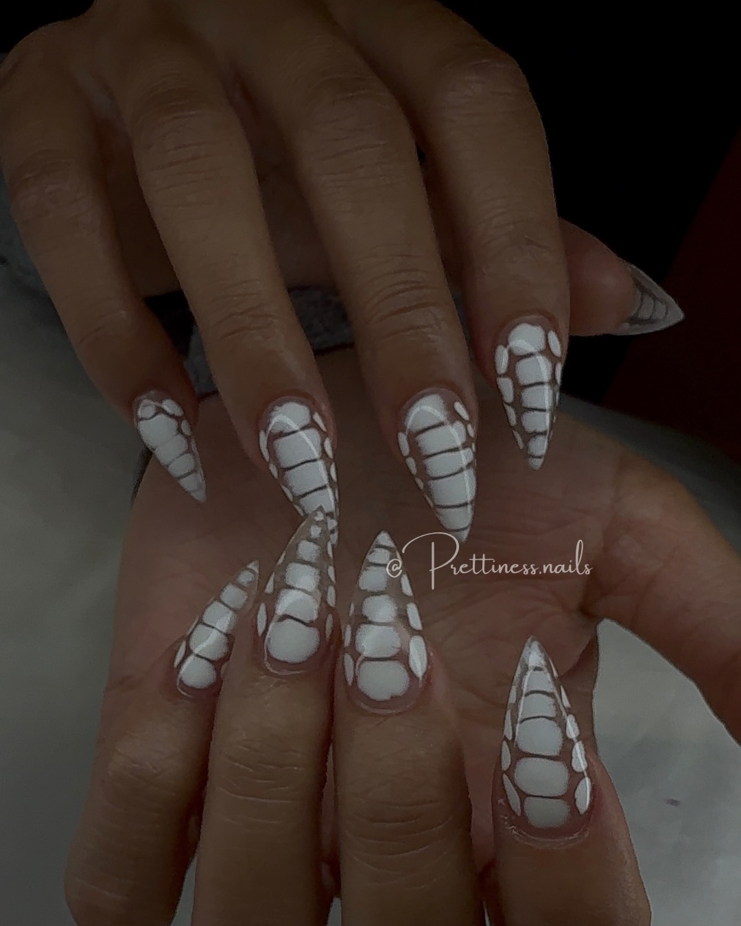 Bold stiletto nails with abstract art